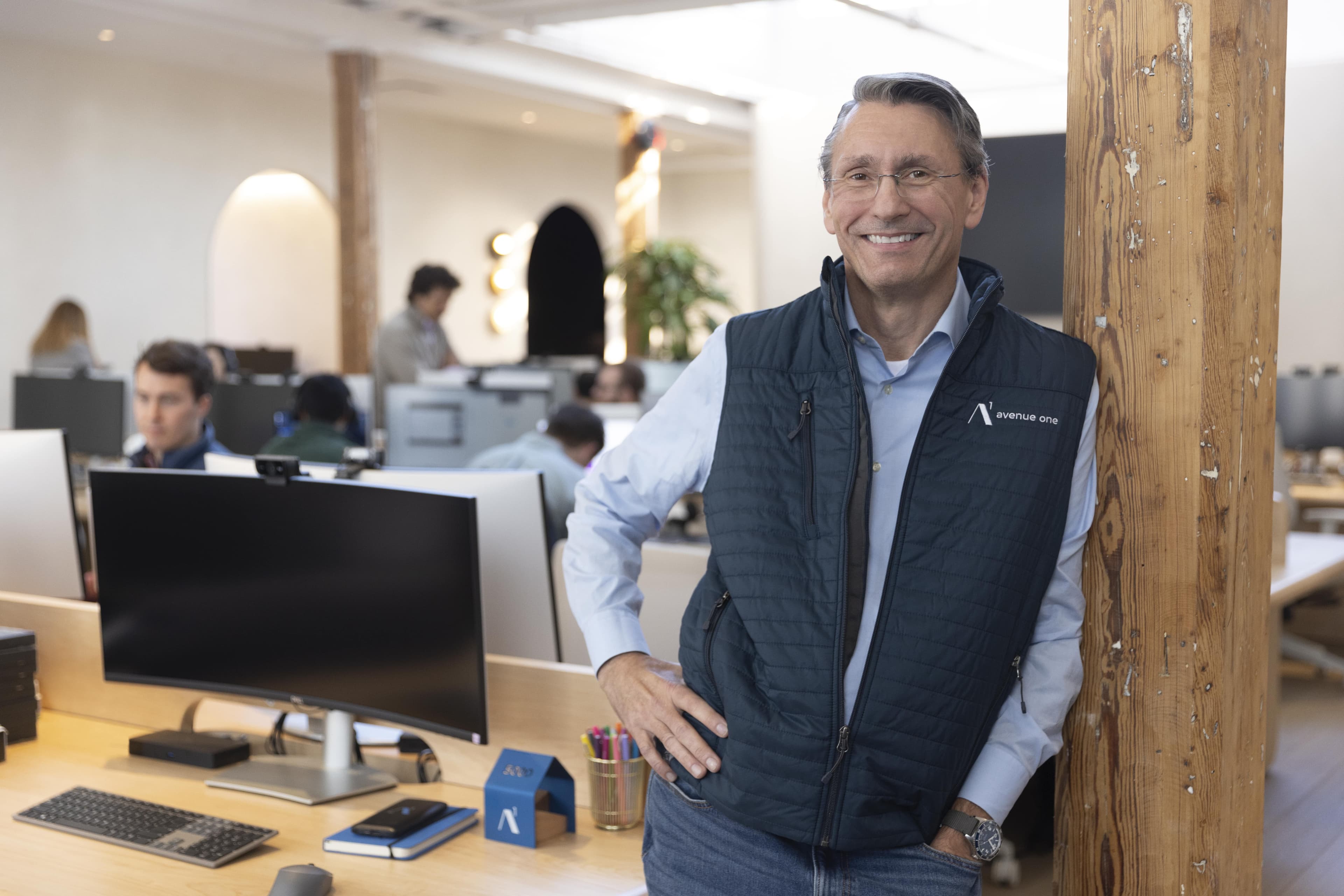 Smiling man standing in front of an office